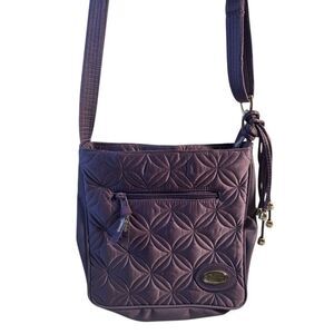Donna Sharp quilted crossbody purple silver tassals